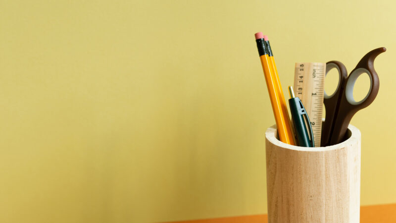 a wooden pen cup